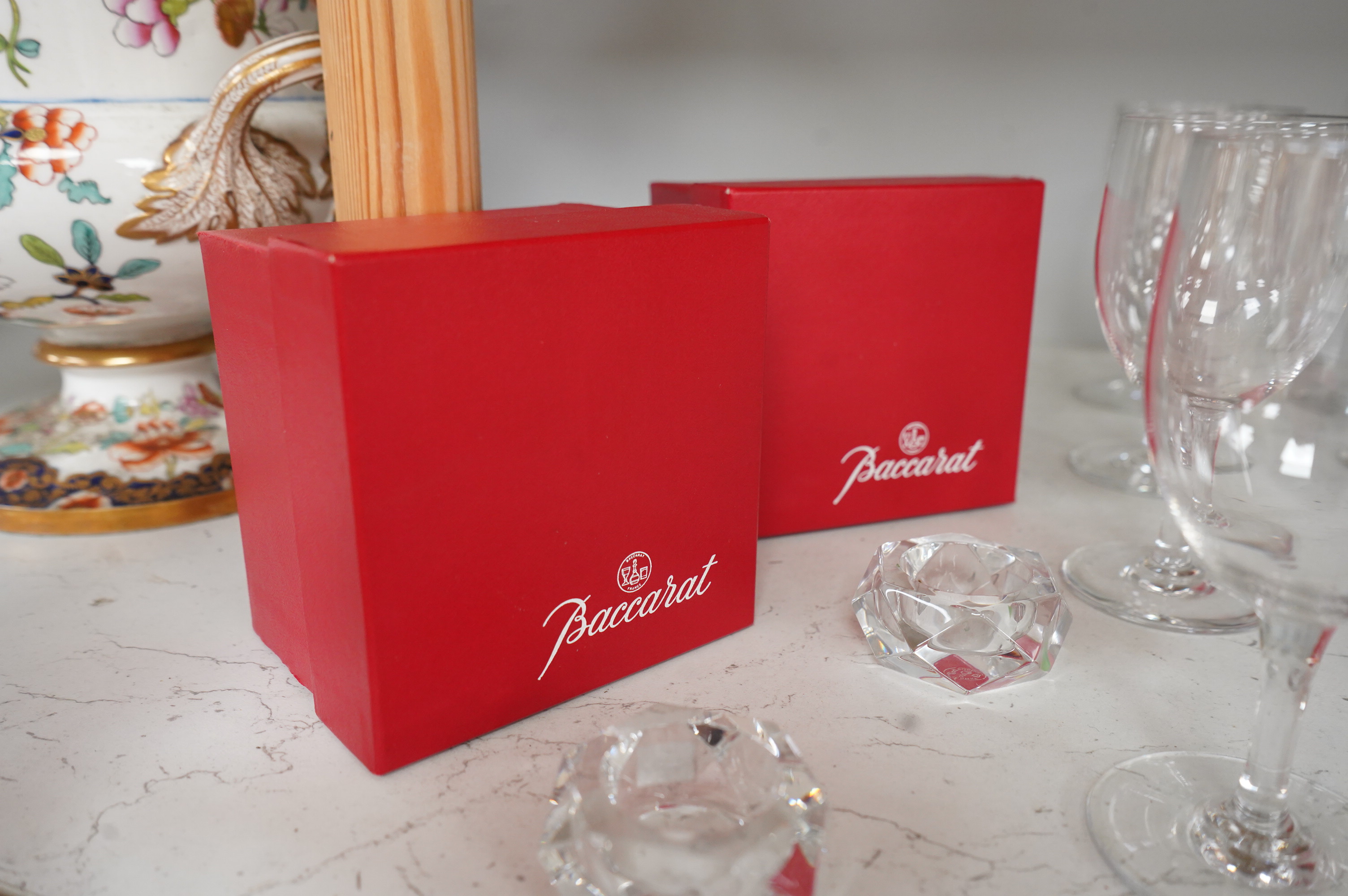 A set of twelve Baccarat crystal wine glasses and two tea light holders, with boxes, glasses 13cm high